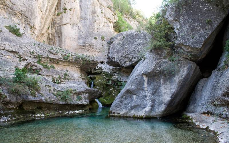 The source of a river between rocky walls