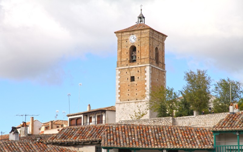 A tower clock over the tiles of Chinchón