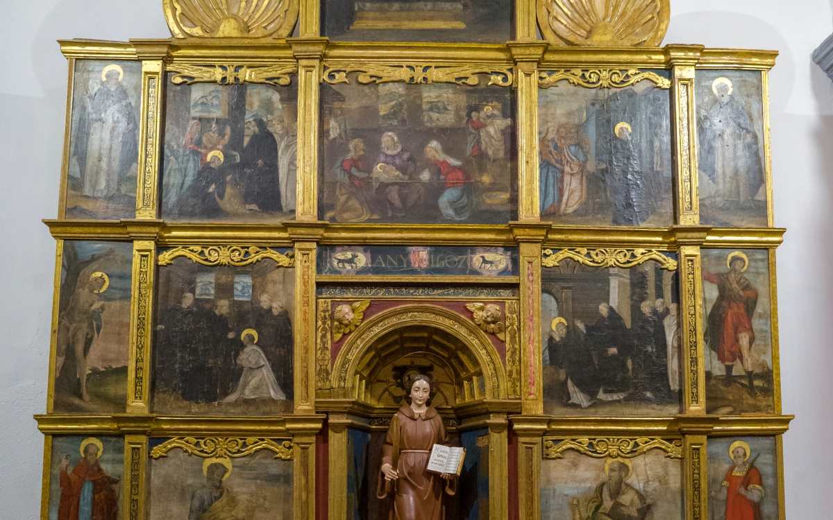 The dogs are part of the church’s retablo.